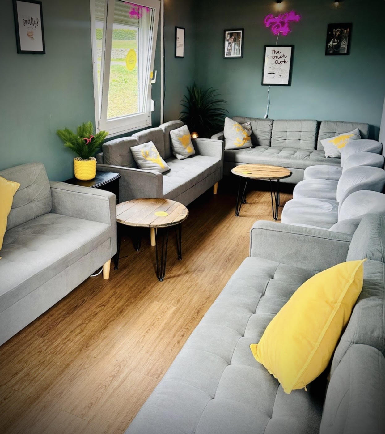 The taproom's lounge area, with sofas and a wooden floor